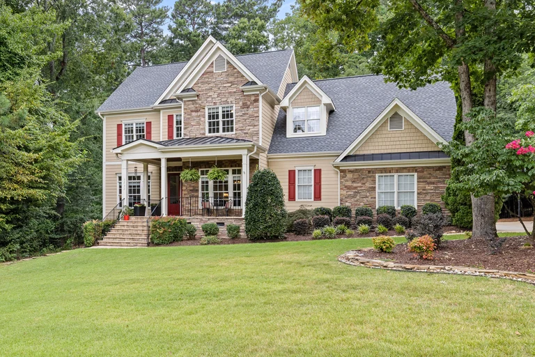 Stock example of a maintained lawn and landscaped home