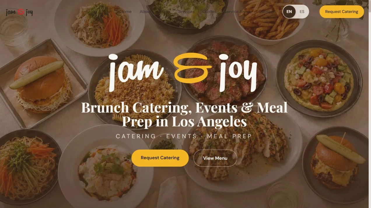 Jam and Joy catering website with a colorful food spread and yellow request catering button